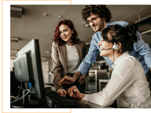Customer success team looking at computer